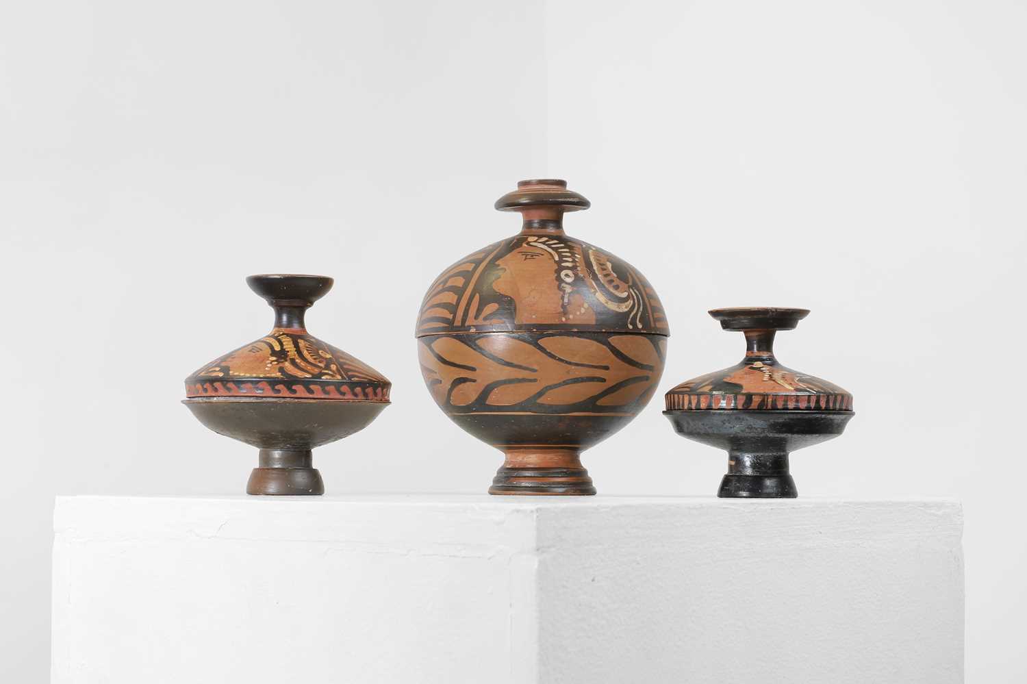 Lot 97 - A group of three Apulian pottery vessels
