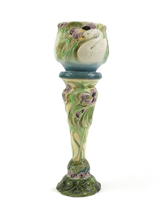 Lot 250 - A Bretby pottery jardinière on stand
