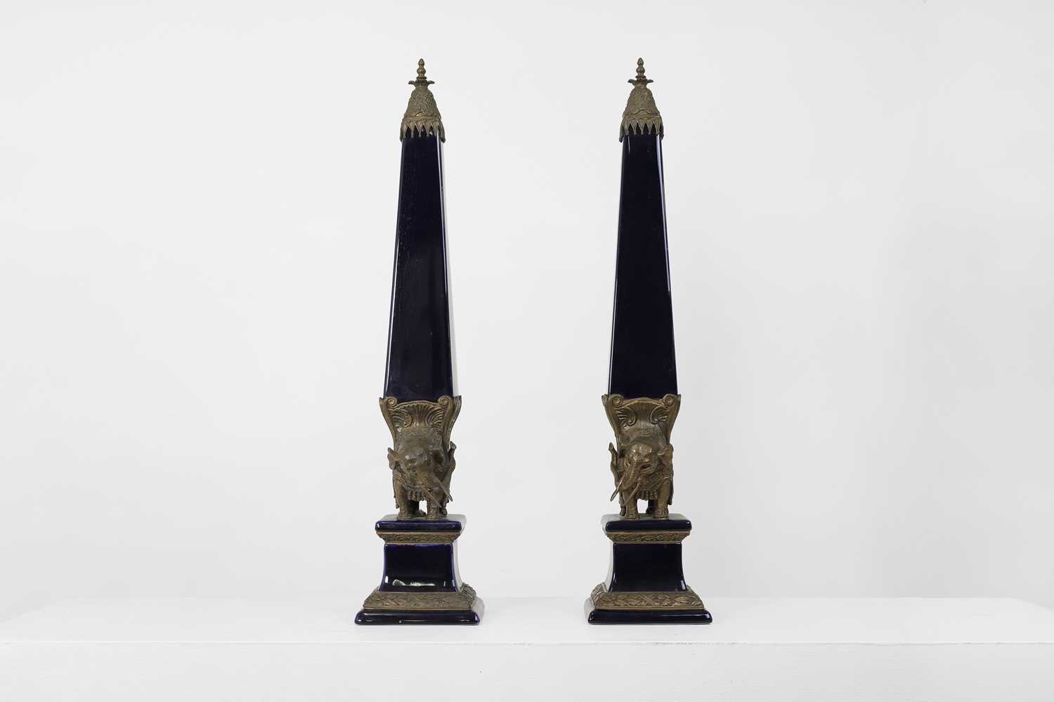 Lot 106 - A pair of porcelain and gilt-metal-mounted obelisks