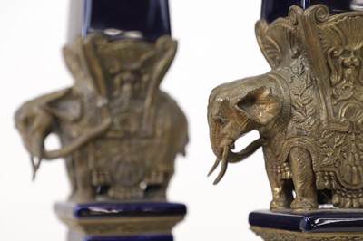 Lot 106 - A pair of porcelain and gilt-metal-mounted obelisks