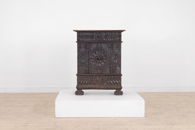 Lot 162 - A carved oak cupboard