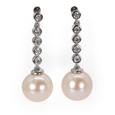 Lot 152 - A pair of white gold diamond and cultured pearl drop stud earrings
