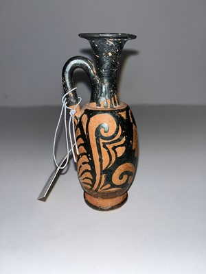 Lot 84 - An Apulian squat red figure pottery lekythos