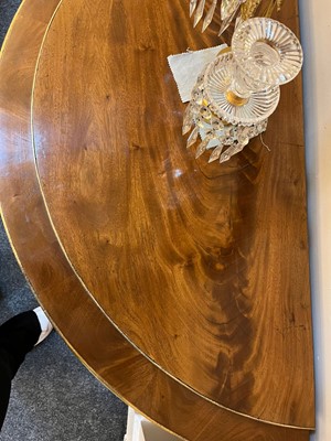 Lot 554 - A pair of neoclassical mahogany and ormolu pier tables