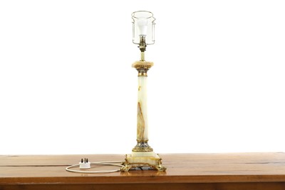 Lot 376 - An onyx and champleve column table lamp