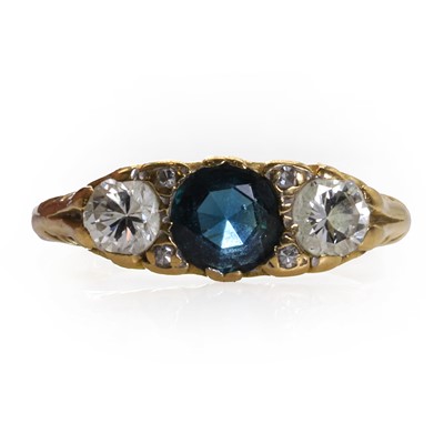 Lot 131 - An 18ct gold sapphire and diamond three stone ring