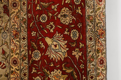 Lot 323 - A Hereke silk rug
