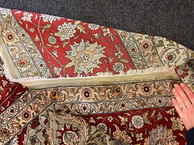 Lot 323 - A Hereke silk rug