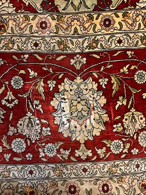 Lot 323 - A Hereke silk rug