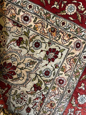 Lot 323 - A Hereke silk rug
