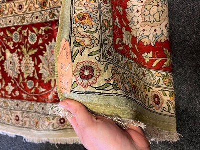 Lot 323 - A Hereke silk rug