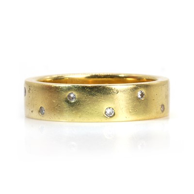 Lot 65 - An 18ct gold diamond wedding ring