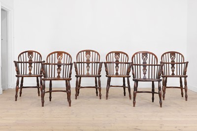 Lot 161 - A matched set of six yew and elm low hoop-back Windsor armchairs