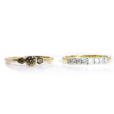 Lot 197 - One coloured diamond ring and a half eternity ring