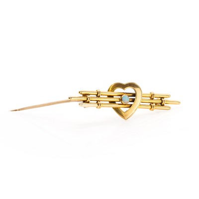 Lot 32 - A gold opal set bar brooch