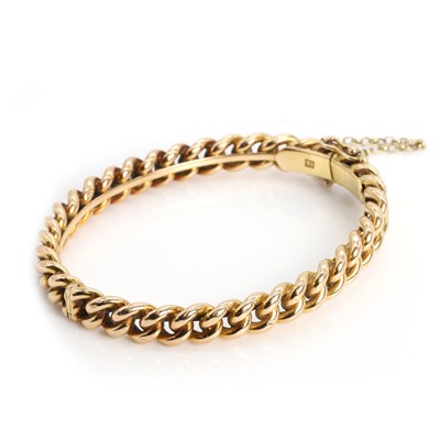 Lot 58 - A  chain and hinged bangle