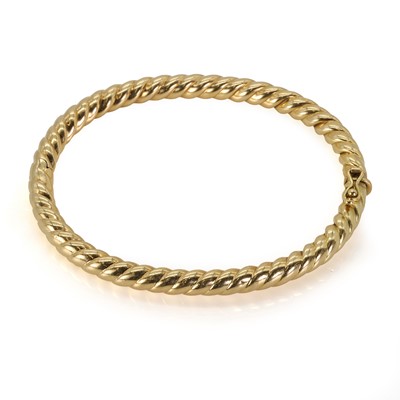 Lot 133 - A twist rope hollow bangle