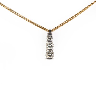 Lot 164 - An 18ct gold diamond three stone pendant and chain