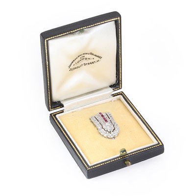 Lot 75 - A diamond and ruby clip brooch, c.1940