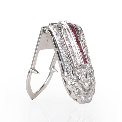 Lot 75 - A diamond and ruby clip brooch, c.1940