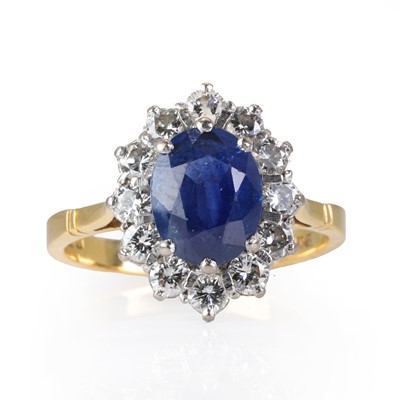 Lot 159 - An 18ct gold sapphire and diamond cluster ring