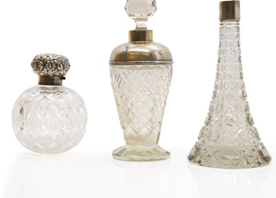 Lot 45 - A collection of silver mounted glass scent bottles