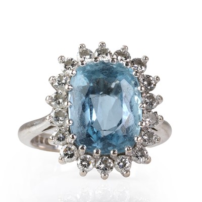 Lot 192 - An 18ct white gold aquamarine and diamond cluster ring