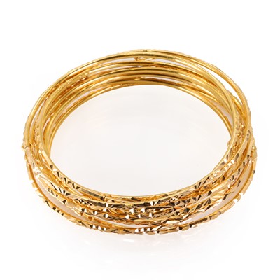 Lot 252 - A group of nine plain gold bangles