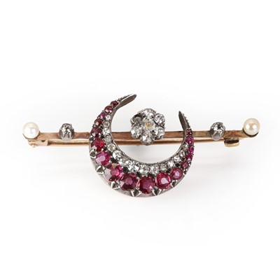Lot 21 - A late Victorian ruby, diamond and pearl crescent brooch