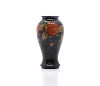 Lot 153 - A William Moorcroft 'Pomegranate' pattern pottery vase
