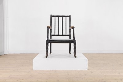 Lot 158 - An ebonised bobbin-framed nursing chair