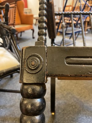 Lot 158 - An ebonised bobbin-framed nursing chair