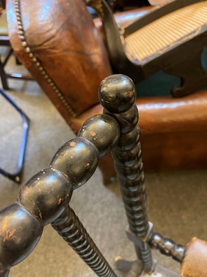 Lot 158 - An ebonised bobbin-framed nursing chair