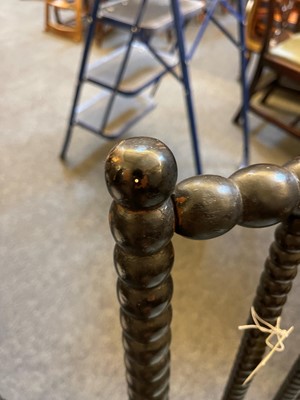 Lot 158 - An ebonised bobbin-framed nursing chair