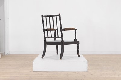 Lot 158 - An ebonised bobbin-framed nursing chair