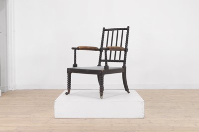 Lot 158 - An ebonised bobbin-framed nursing chair