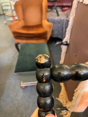 Lot 158 - An ebonised bobbin-framed nursing chair