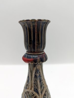 Lot 141 - A pair of Doulton Lambeth stoneware candlesticks