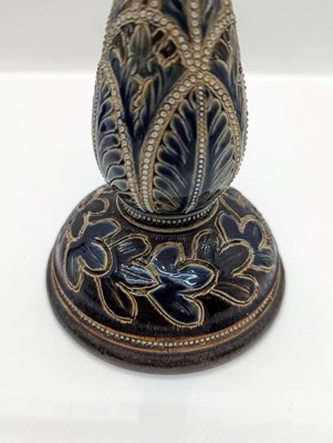 Lot 141 - A pair of Doulton Lambeth stoneware candlesticks