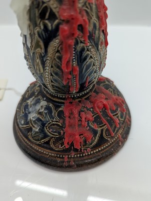 Lot 141 - A pair of Doulton Lambeth stoneware candlesticks