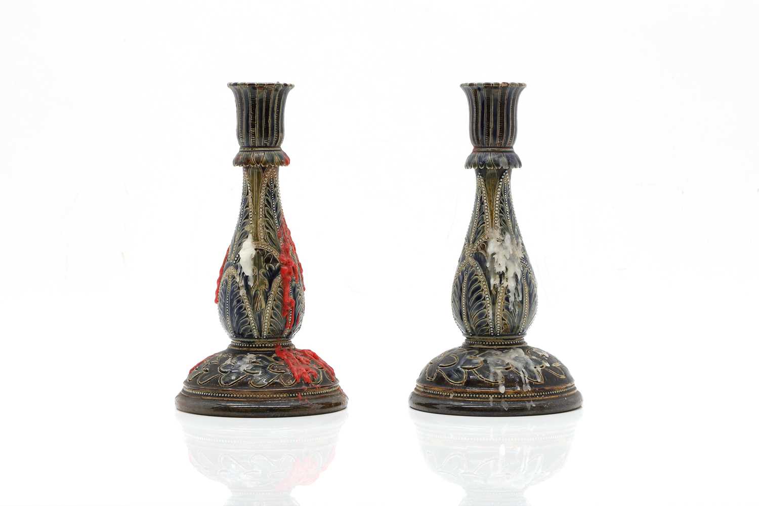 Lot 141 - A pair of Doulton Lambeth stoneware candlesticks