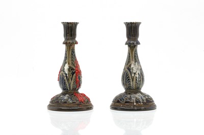 Lot 141 - A pair of Doulton Lambeth stoneware candlesticks