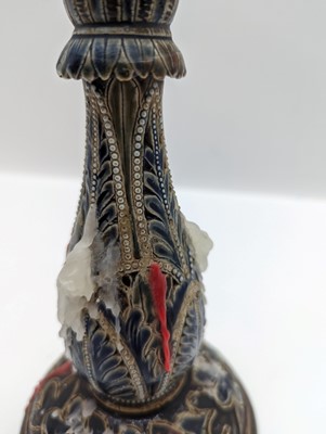 Lot 141 - A pair of Doulton Lambeth stoneware candlesticks