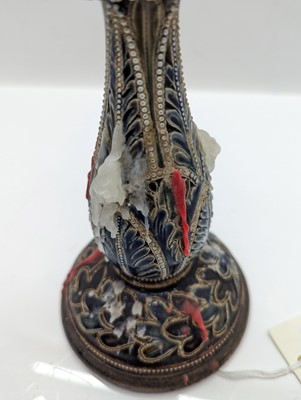 Lot 141 - A pair of Doulton Lambeth stoneware candlesticks