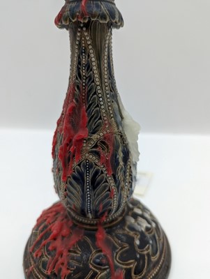 Lot 141 - A pair of Doulton Lambeth stoneware candlesticks