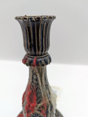 Lot 141 - A pair of Doulton Lambeth stoneware candlesticks
