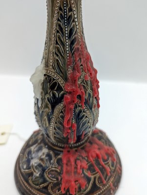 Lot 141 - A pair of Doulton Lambeth stoneware candlesticks