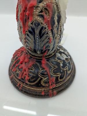 Lot 141 - A pair of Doulton Lambeth stoneware candlesticks