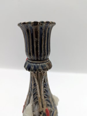 Lot 141 - A pair of Doulton Lambeth stoneware candlesticks