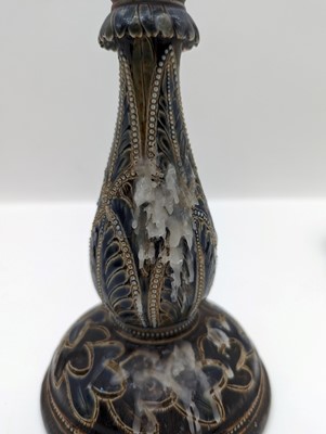 Lot 141 - A pair of Doulton Lambeth stoneware candlesticks